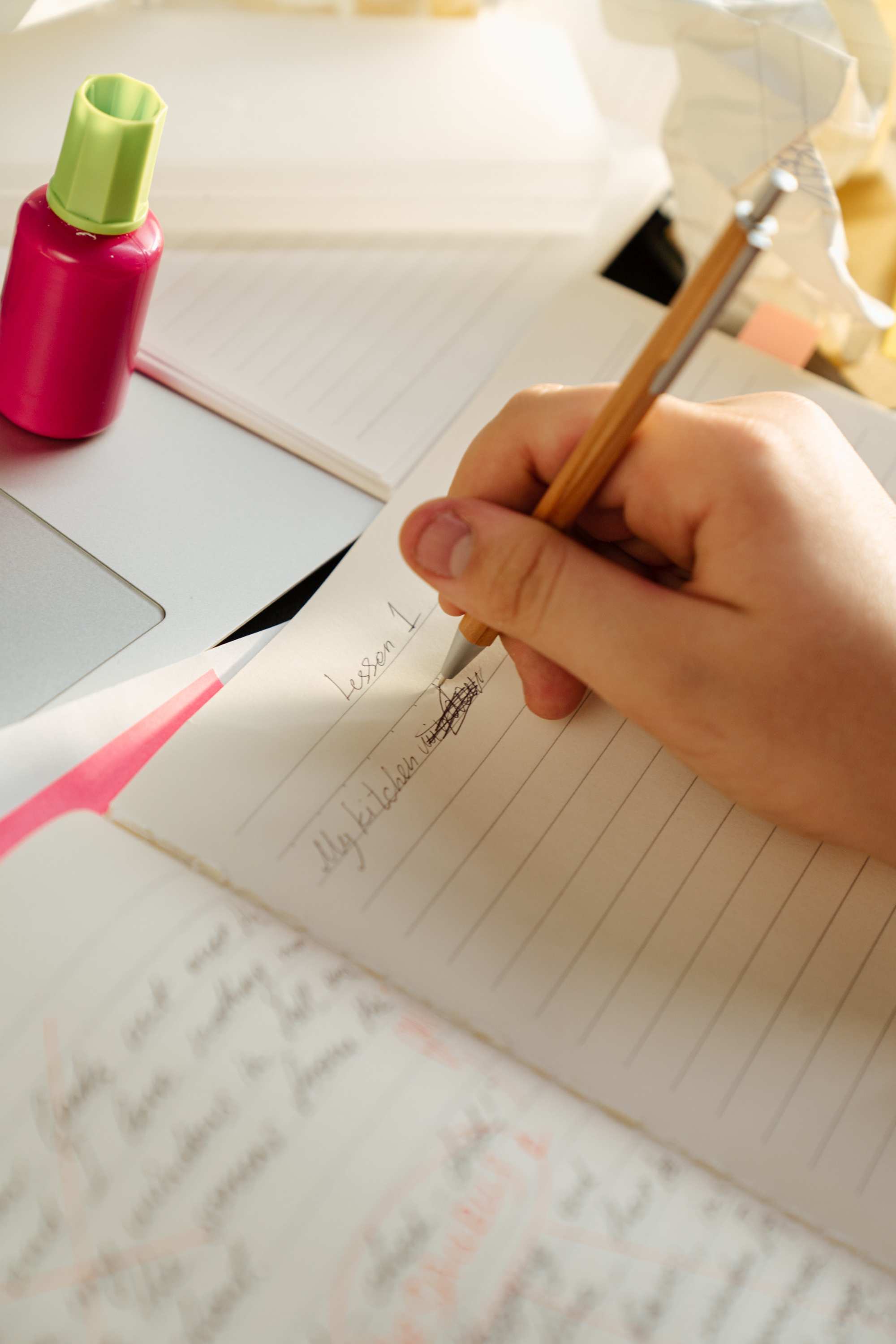 Close up on pen writing in a notebook