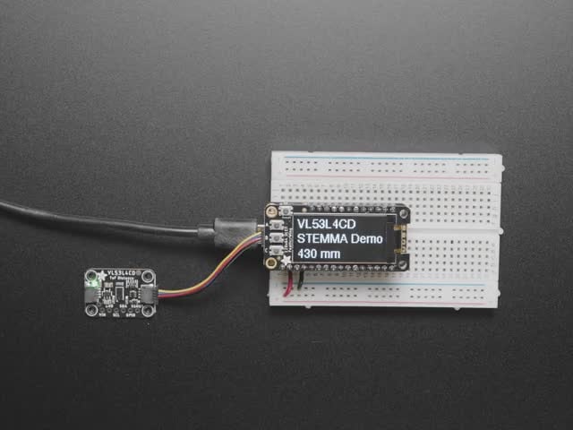Adafruit VL53L4CD Time of Flight Distance Sensor - ~1 to 1300mm - STEMMA QT / Qwiic - STEMMA QT / Qwiic - Video of a hand hovering over a Adafruit VL53L4CD Time of Flight Distance Sensor thats connected to a white breadboard reading the range of motion of the hand. 