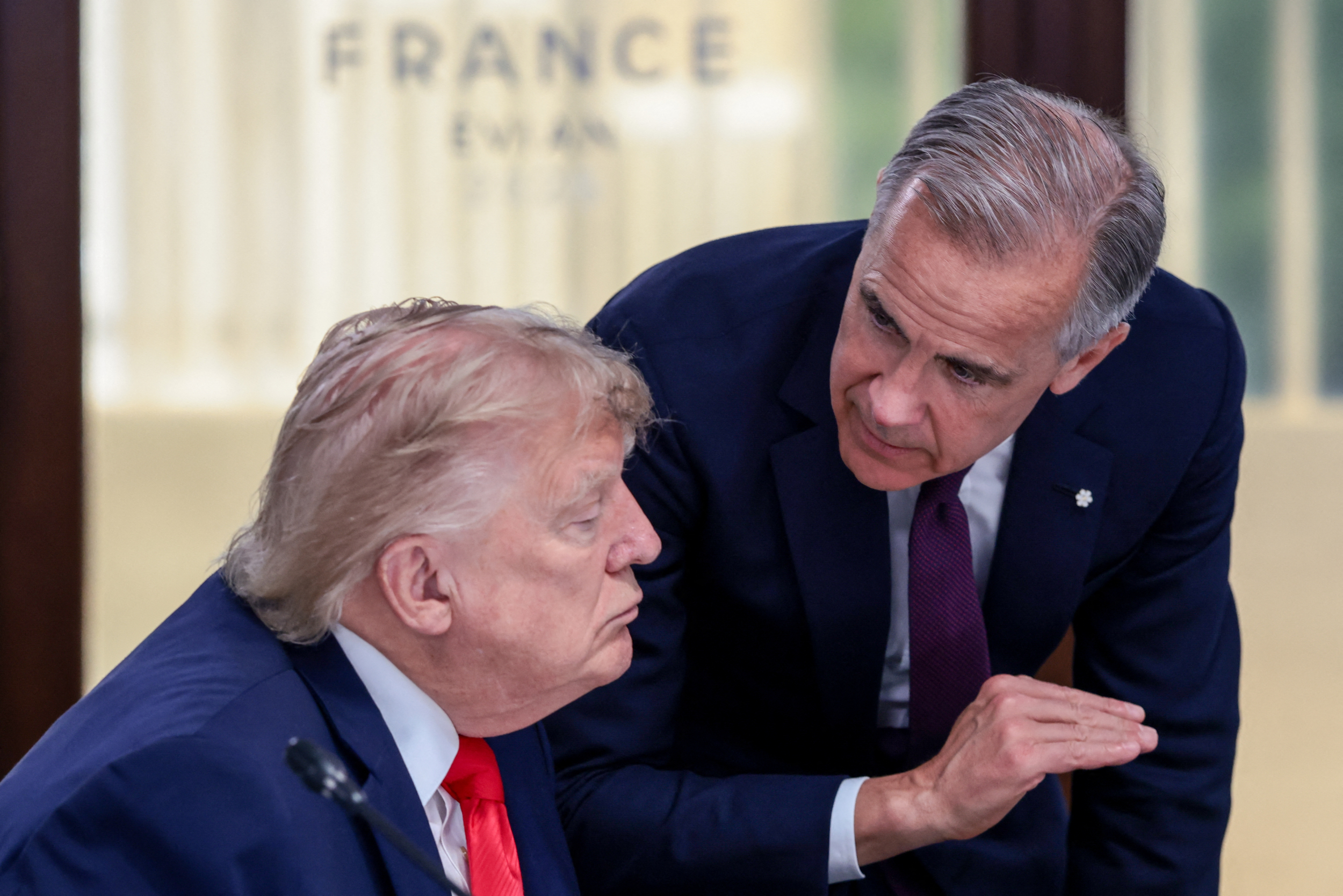 President Donald Trump speaks with Canada's Prime Minister Mark Carney