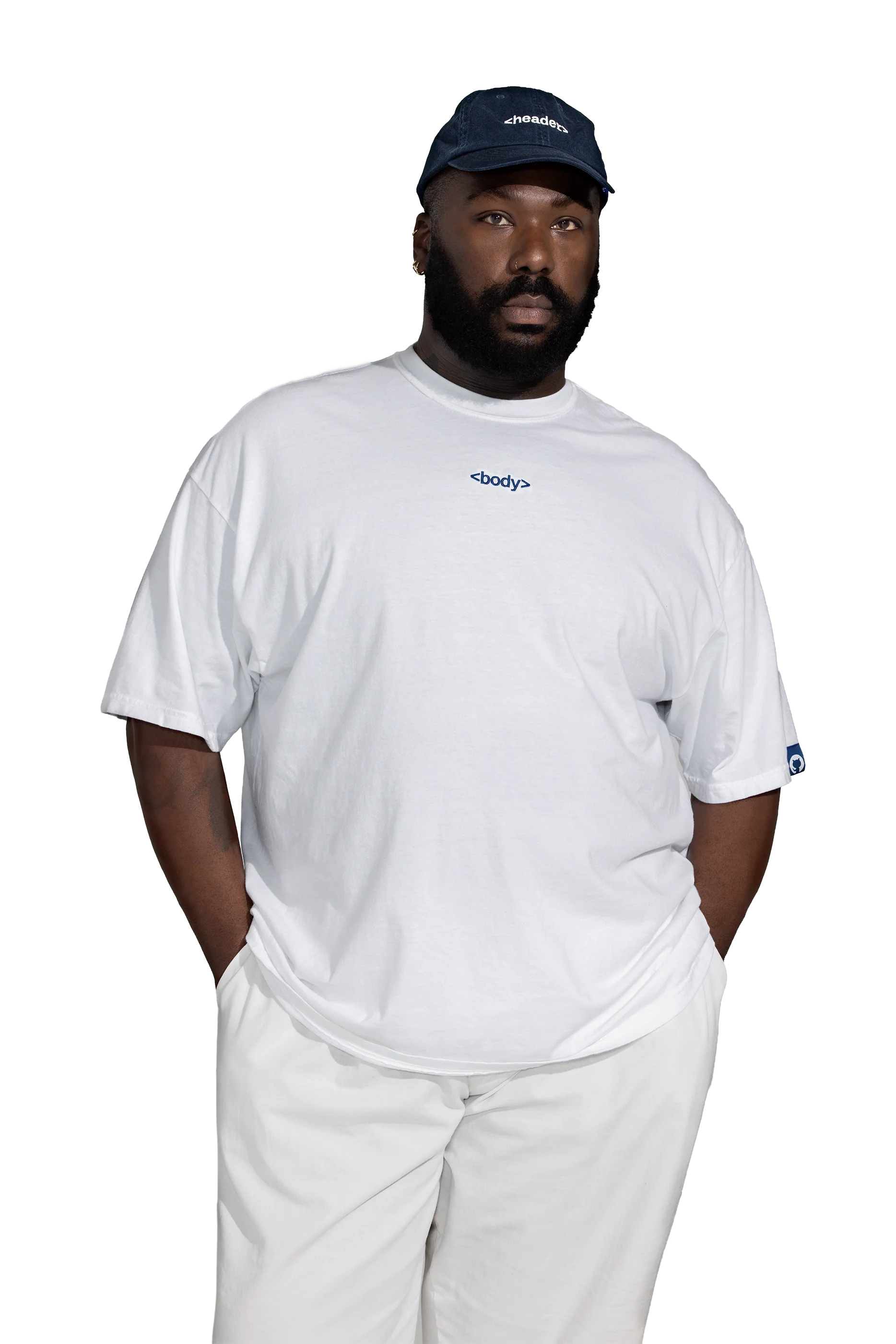 Male model wearing navy blue header hat and white body tee